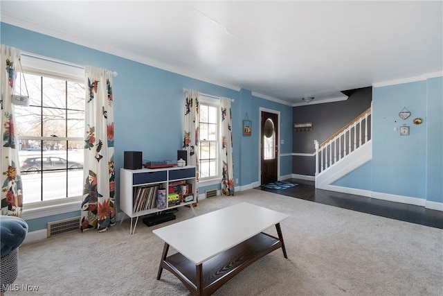 living room featuring carpet floors and crown molding