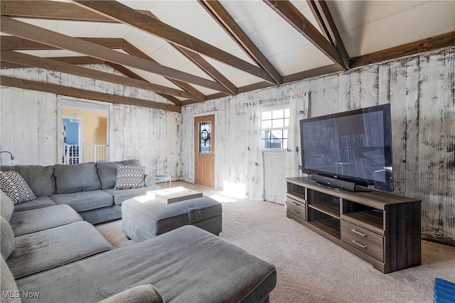 living room with high vaulted ceiling, light carpet, and beamed ceiling