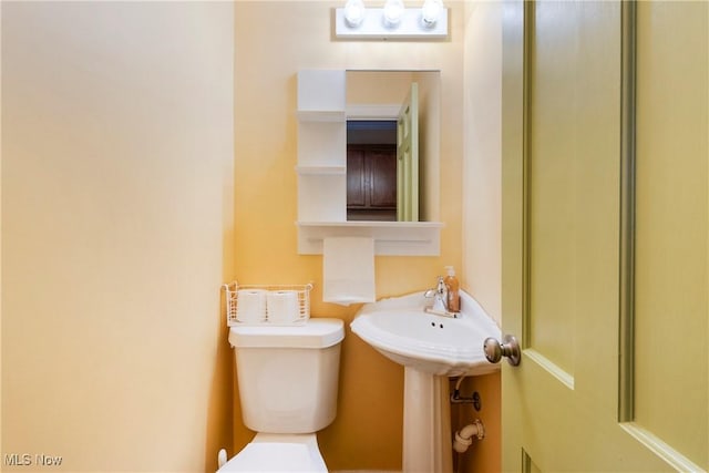 bathroom featuring toilet