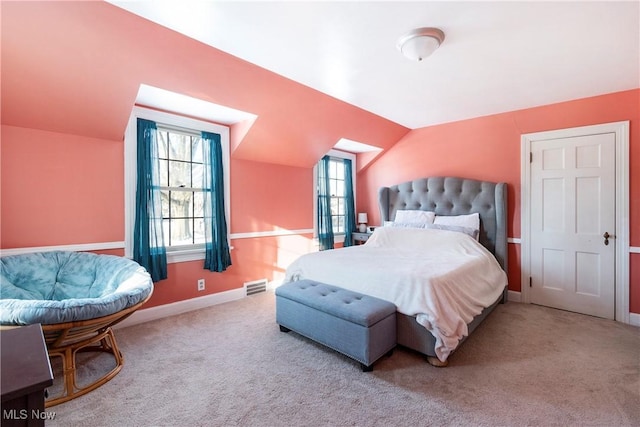 carpeted bedroom with vaulted ceiling