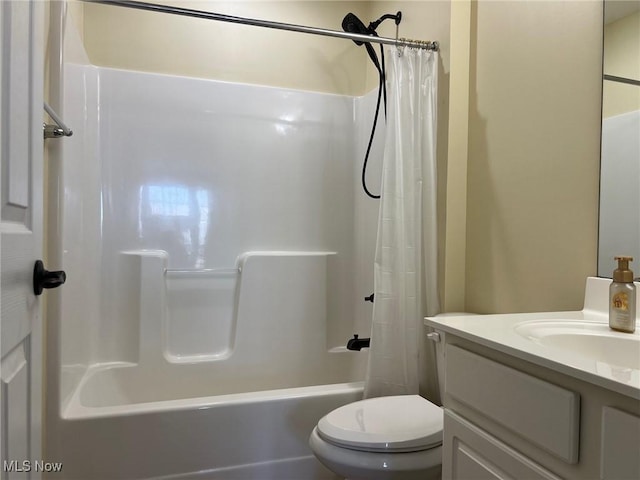 full bathroom with toilet, vanity, and shower / bathtub combination with curtain