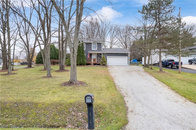 view of front facade with a front yard and a garage