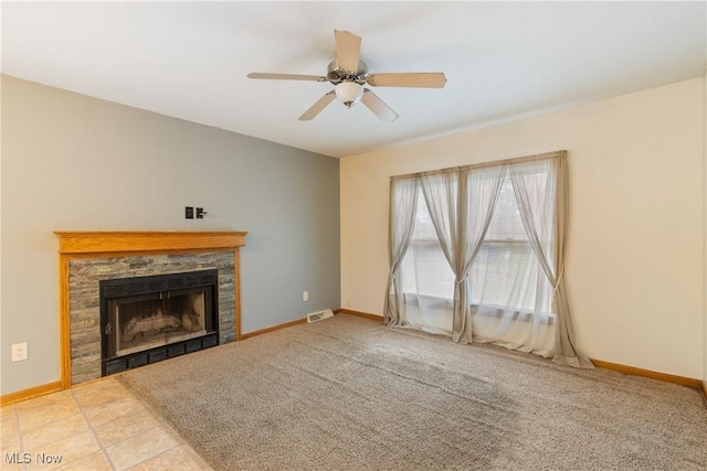 unfurnished living room with carpet floors, a fireplace, and ceiling fan