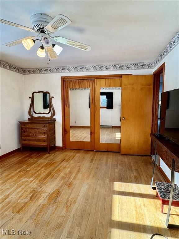 interior space featuring ceiling fan, light hardwood / wood-style flooring, and french doors