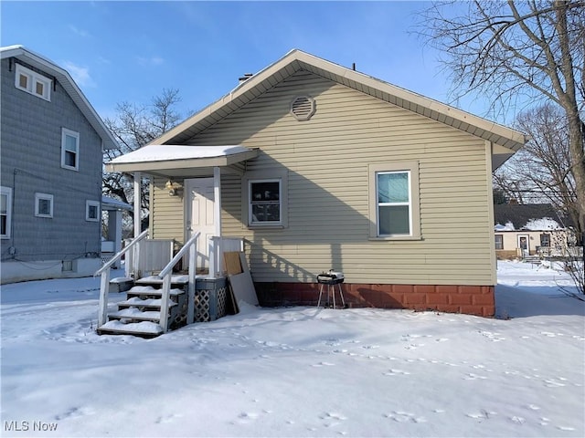 view of snow covered house