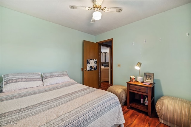 bedroom featuring ceiling fan and dark hardwood / wood-style floors