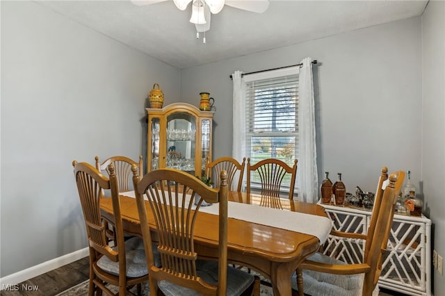 dining space featuring ceiling fan and wood-type flooring