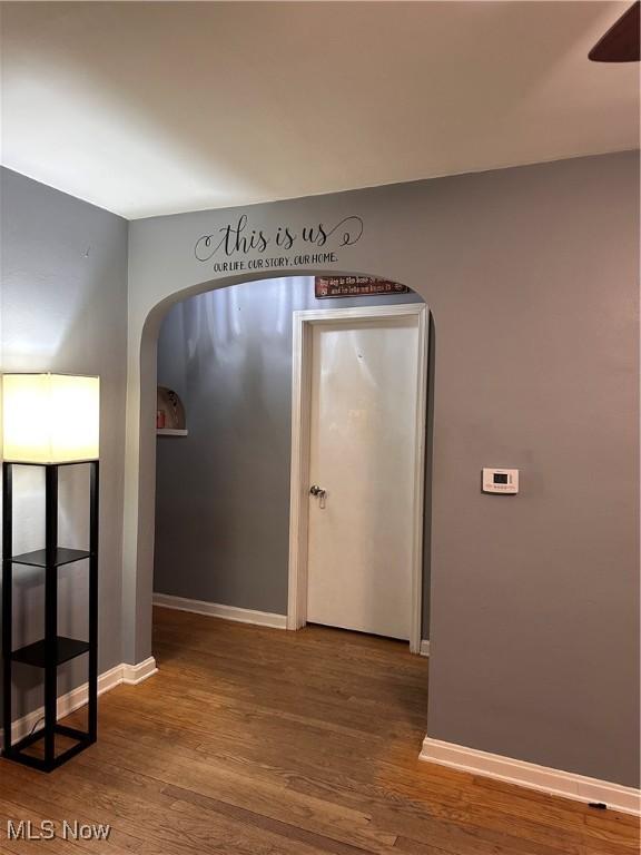 hallway with wood-type flooring