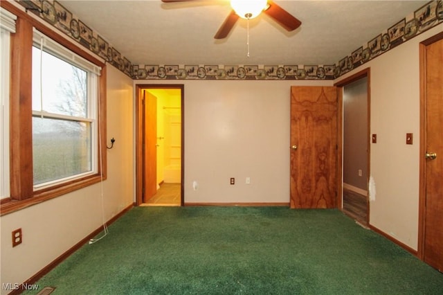 spare room with carpet floors and ceiling fan