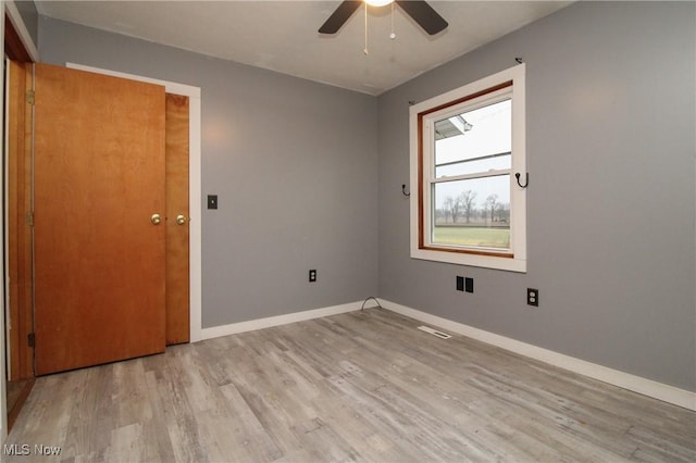 unfurnished room featuring ceiling fan and light hardwood / wood-style floors