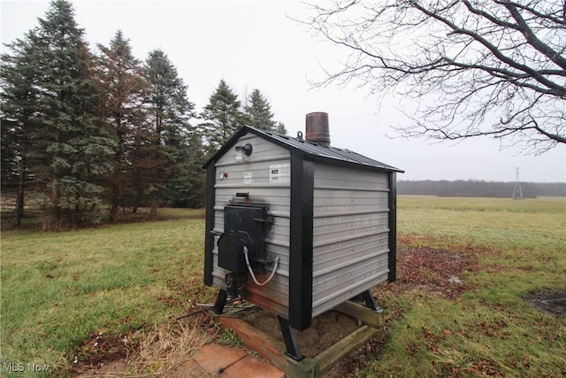 view of outdoor structure with a lawn