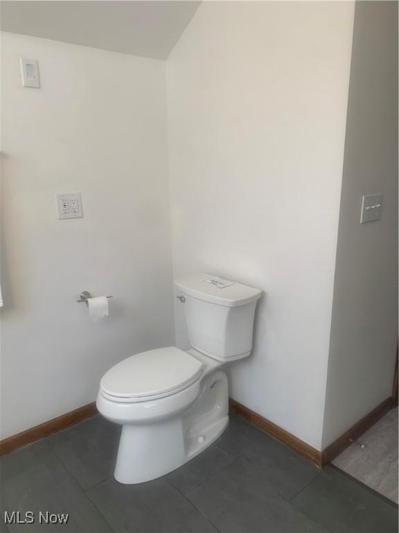 bathroom featuring tile patterned floors and toilet