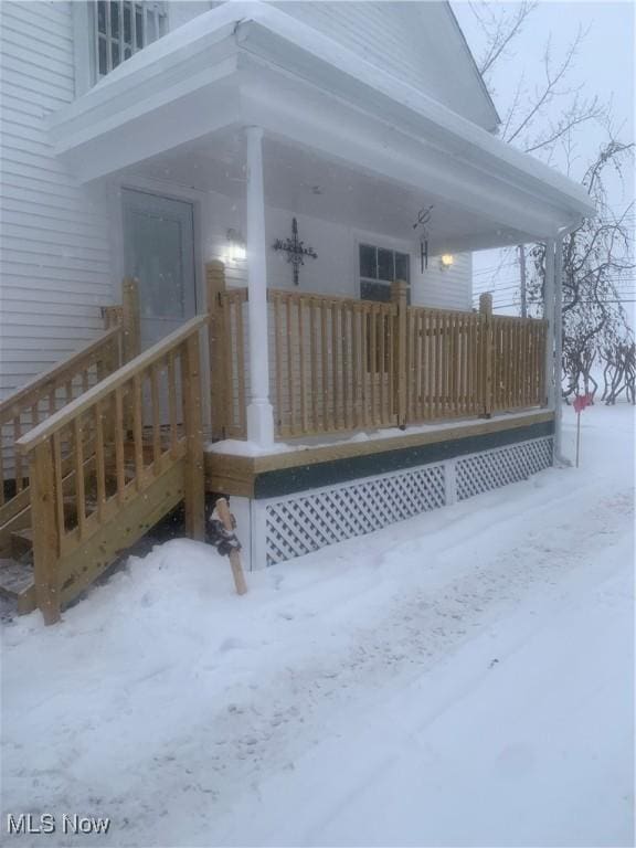 view of snow covered deck