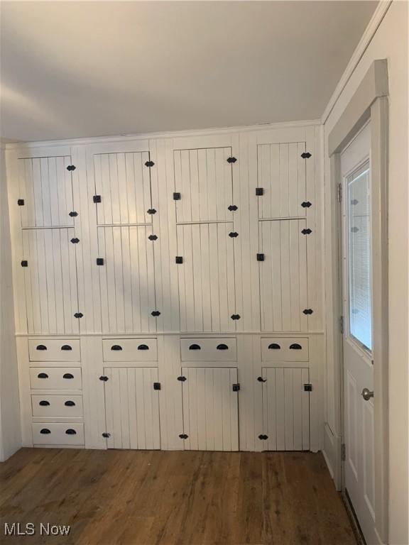 interior details featuring hardwood / wood-style floors, ornamental molding, and mail boxes