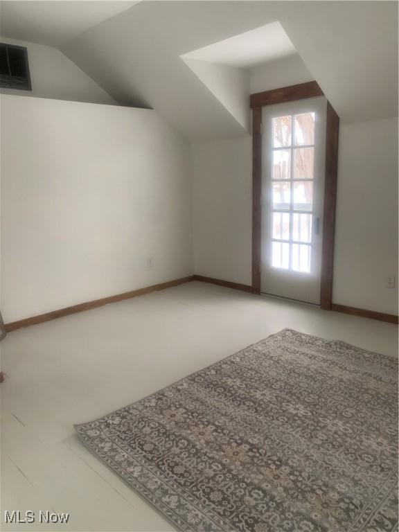 bonus room featuring vaulted ceiling