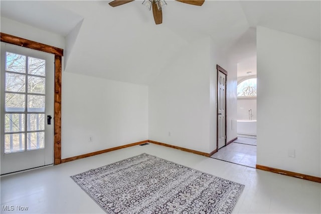 bonus room with vaulted ceiling, baseboards, and ceiling fan