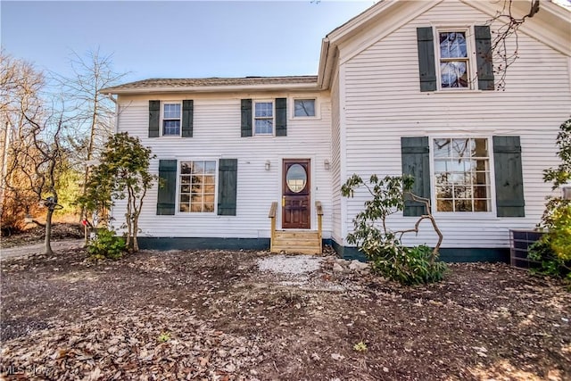 view of front of property featuring entry steps and cooling unit