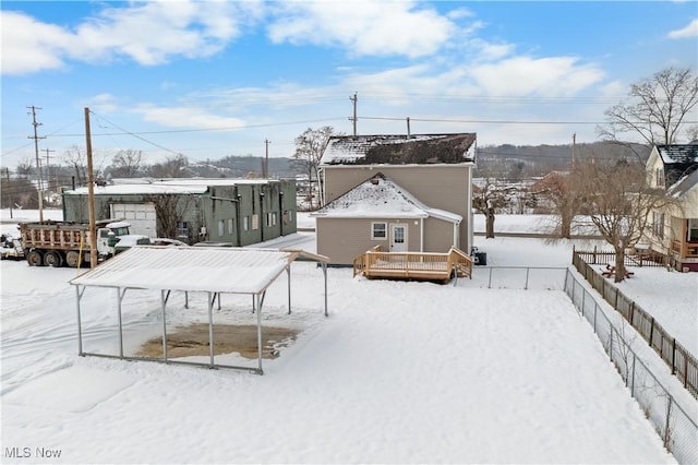 view of snow covered deck