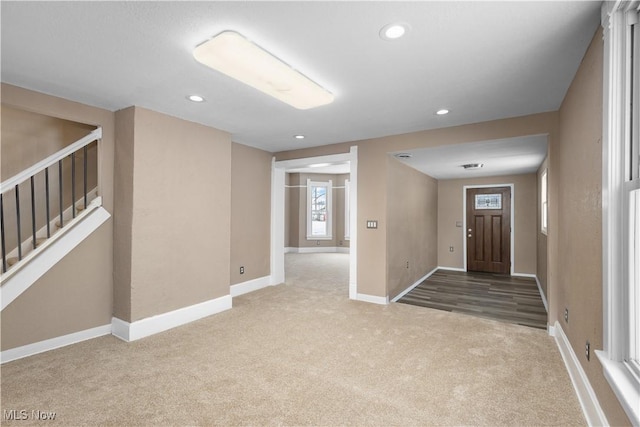 view of carpeted foyer