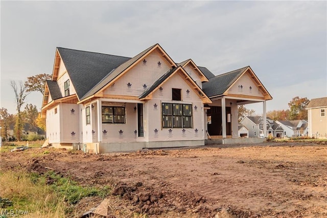 property in mid-construction with covered porch