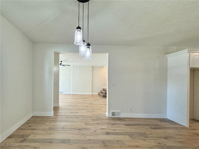 unfurnished dining area with light hardwood / wood-style flooring