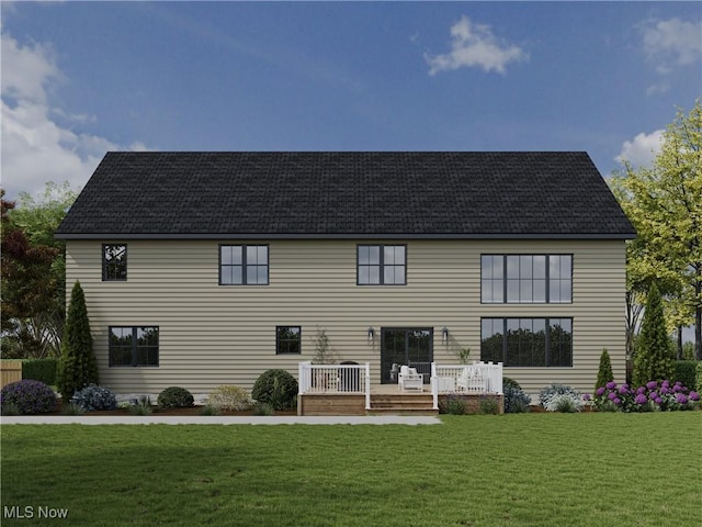 view of front facade with a wooden deck and a front yard