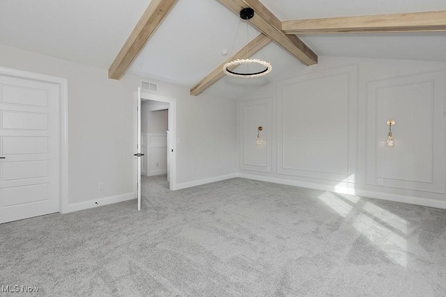 unfurnished bedroom featuring carpet, visible vents, vaulted ceiling with beams, and baseboards