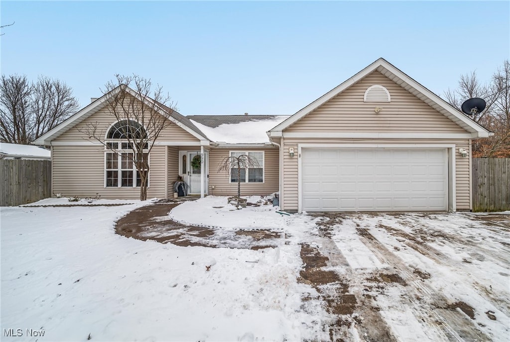 single story home with a garage