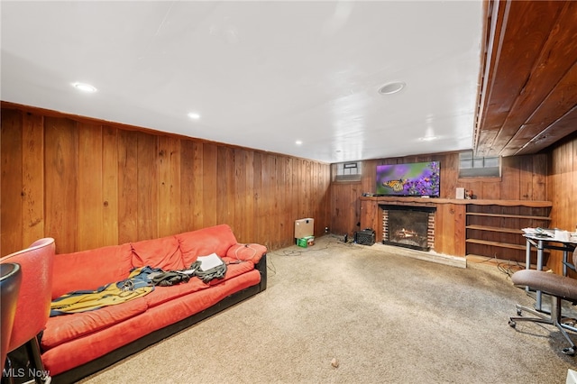 carpeted living room featuring a fireplace