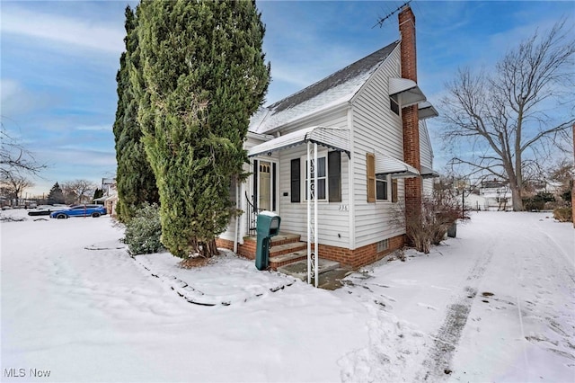 view of snow covered property