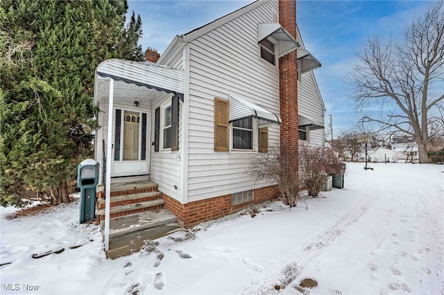 view of snow covered property