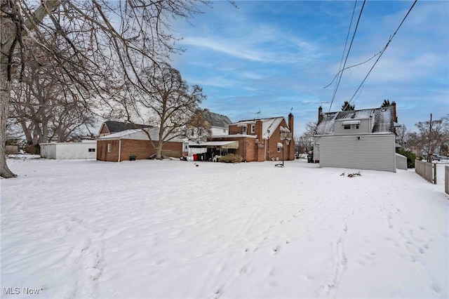 view of yard covered in snow