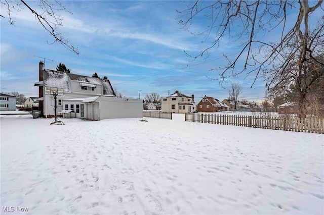 view of yard covered in snow