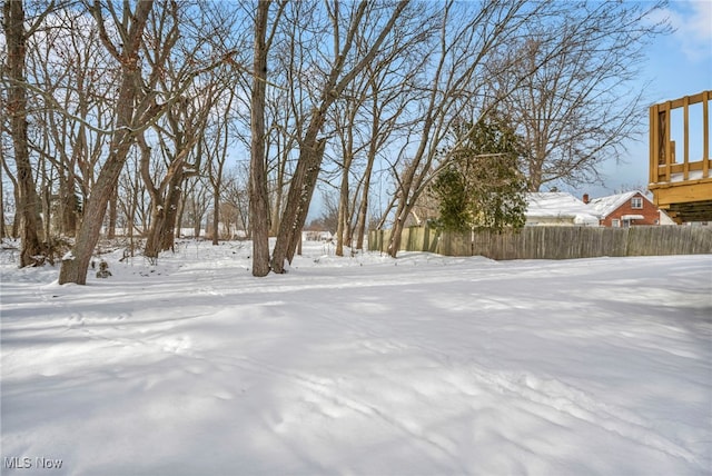 view of yard layered in snow