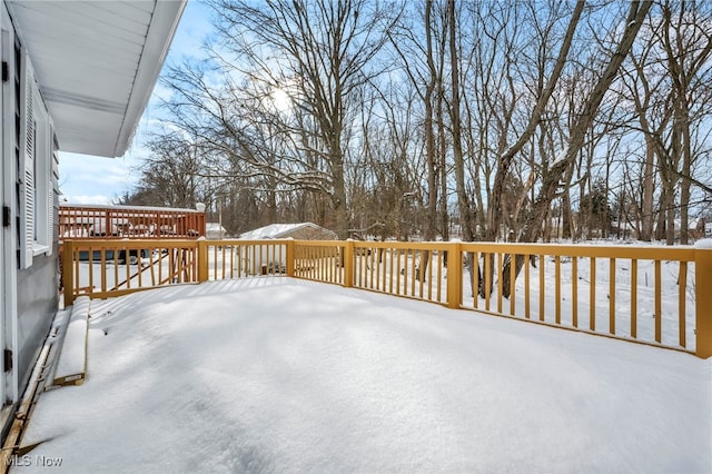 view of snow covered deck