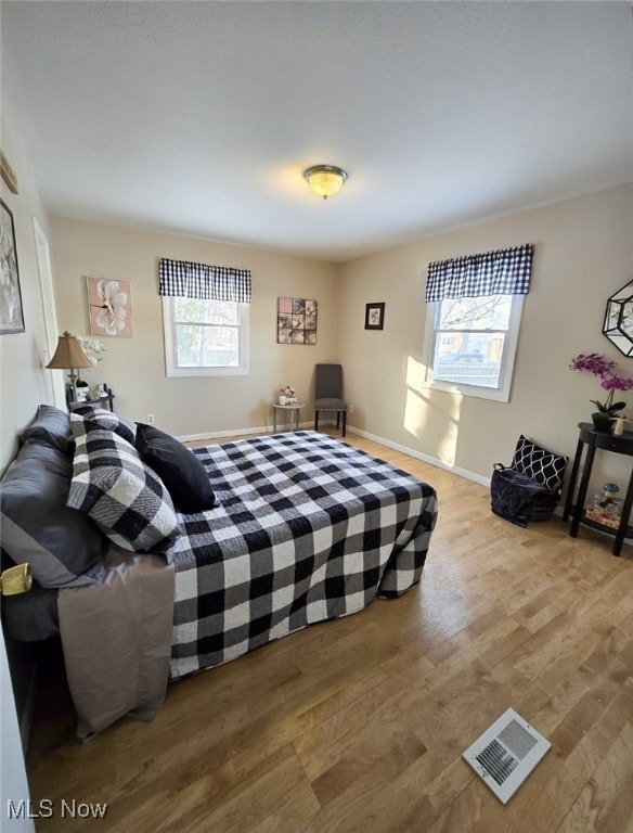 bedroom with wood-type flooring