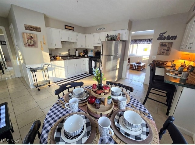 tiled dining area with sink