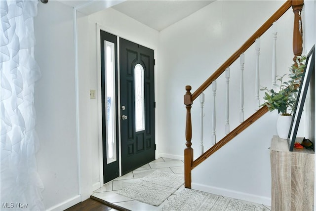 foyer entrance with tile patterned floors