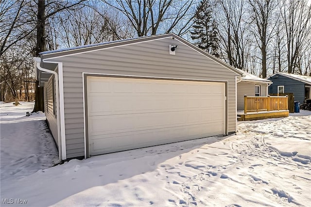 view of snow covered garage