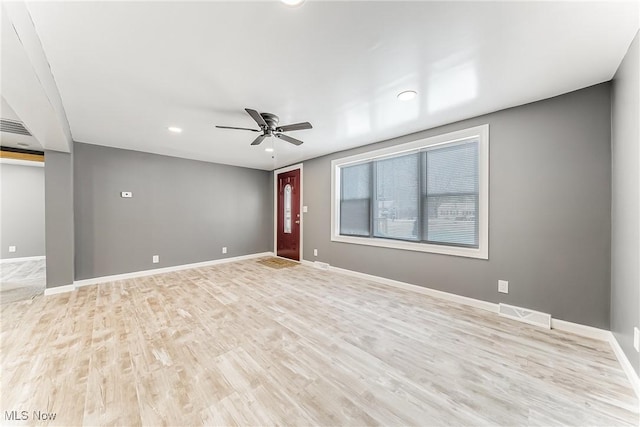 unfurnished room featuring ceiling fan and light wood-type flooring