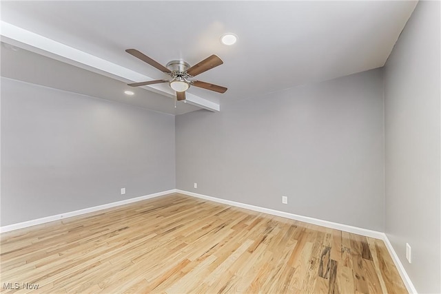 spare room with ceiling fan and light hardwood / wood-style floors