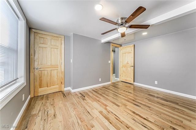 unfurnished bedroom with light hardwood / wood-style floors and ceiling fan