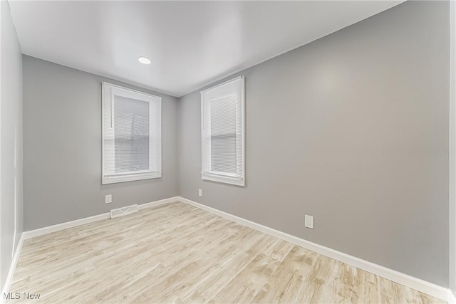 unfurnished room featuring light wood-type flooring