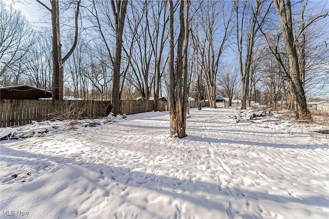 view of yard layered in snow