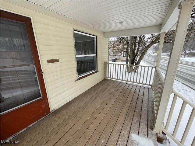 view of snow covered deck