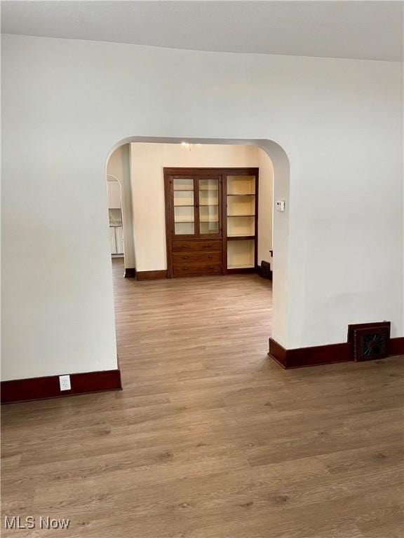 spare room featuring hardwood / wood-style flooring