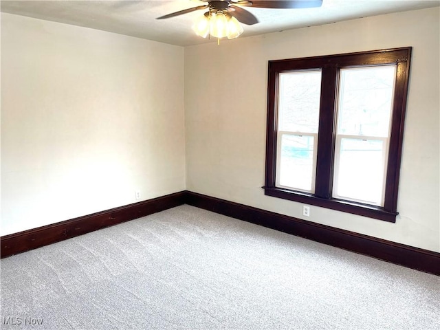 carpeted empty room with ceiling fan