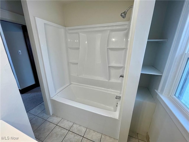 bathroom with tile patterned flooring and shower / bathing tub combination