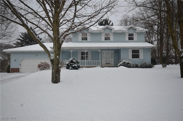 view of front property featuring a garage and a porch