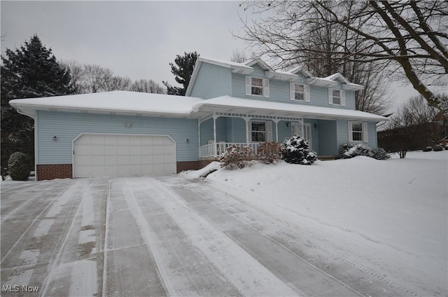 view of property featuring a garage and a porch